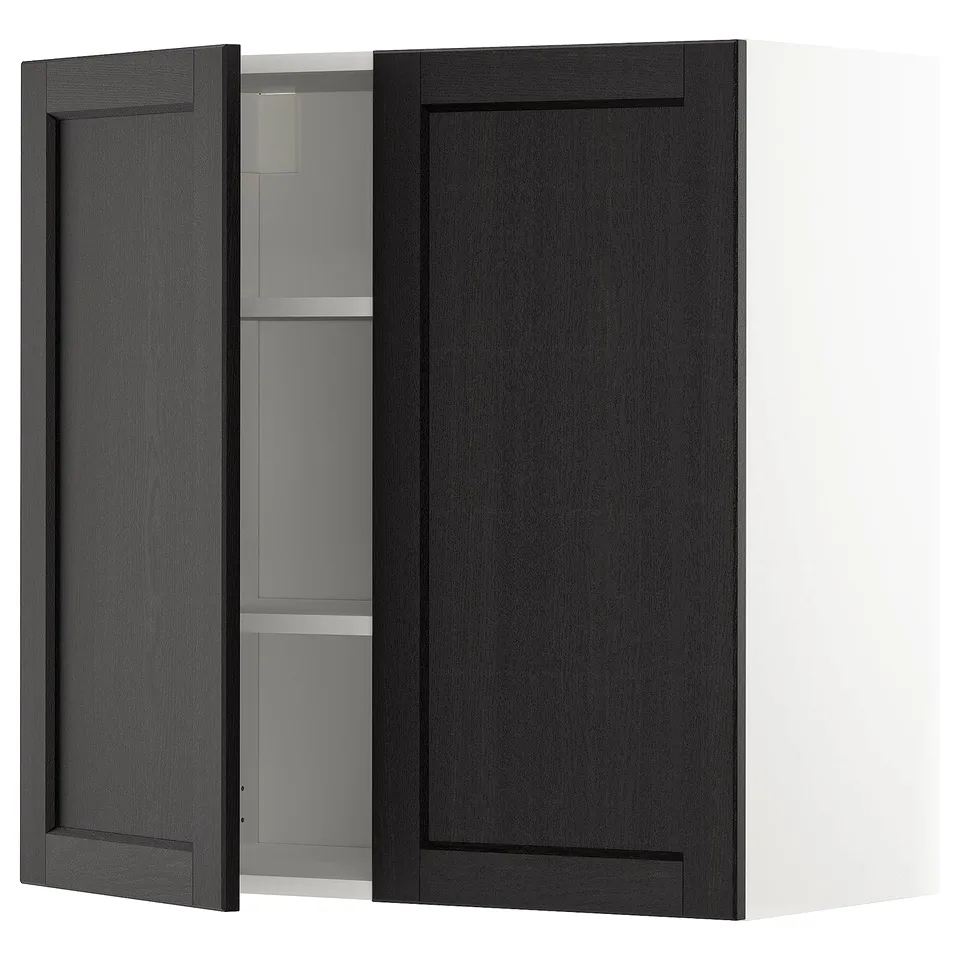 Depicts a black stained kitchen cabinet from the METOD system, featuring dark wood with bevelled edges and a white interior with adjustable shelves.