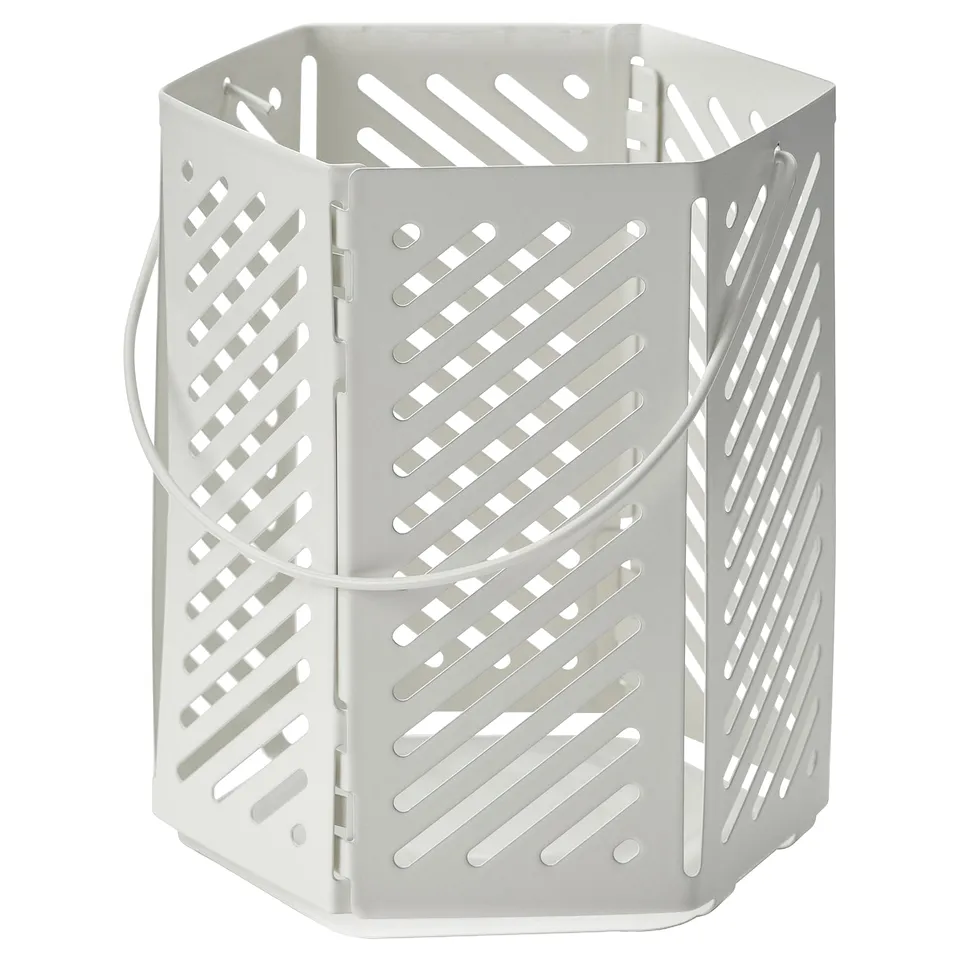 White VÅRSYREN lantern with perforated design and handle, casting shadows.