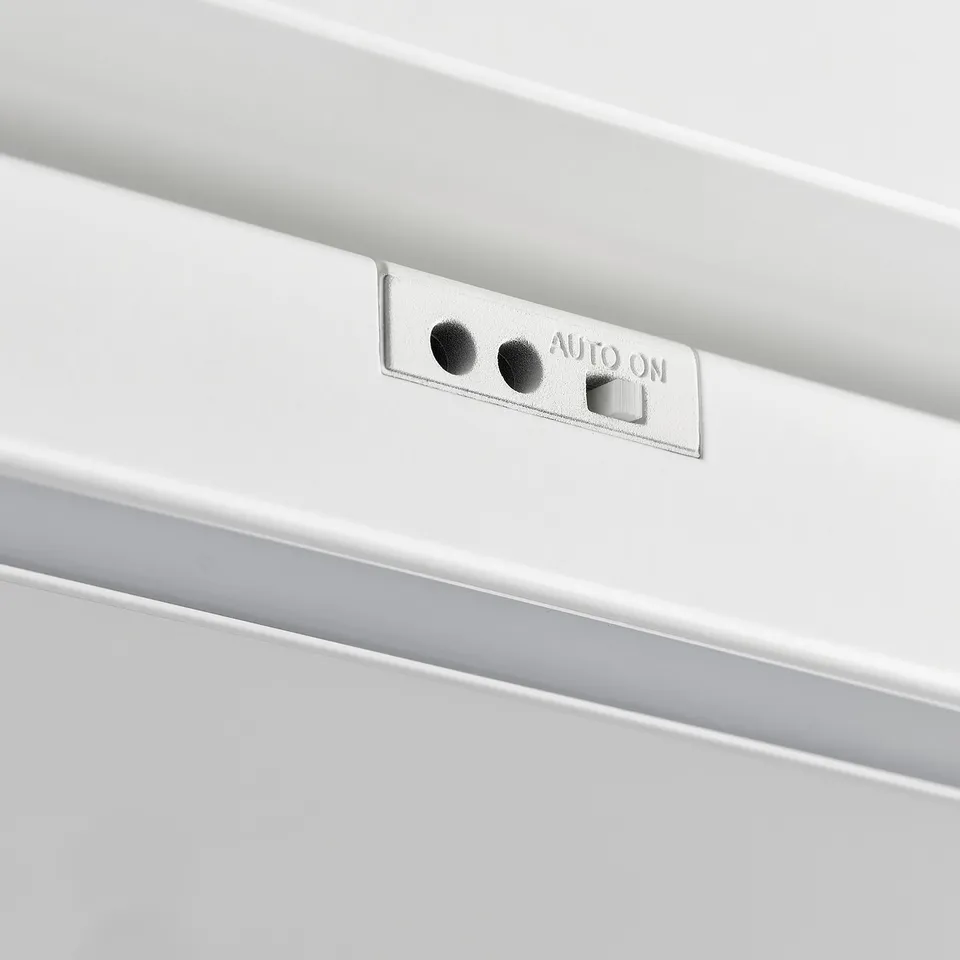 Close-up of modern, high-quality led light switch. Sleek white design with advertisement label, indicating advanced technology.