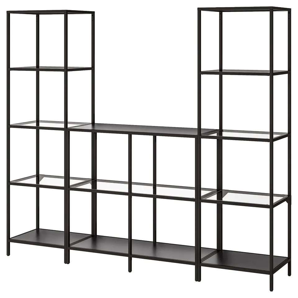 A modern, black VITTSJÖ bookshelf with metal and glass shelves, offering an airy design for displaying items.