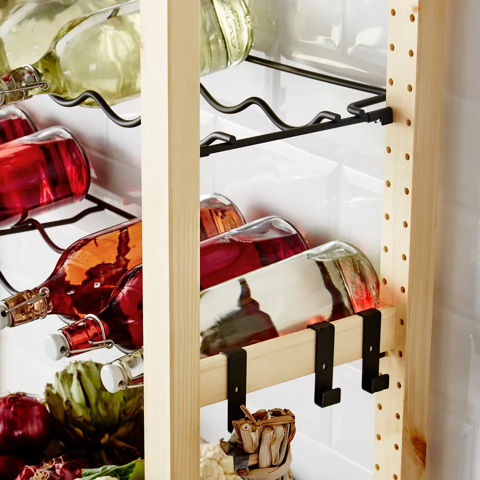 Wine rack mounted on IVAR storage, holding multiple wine bottles.