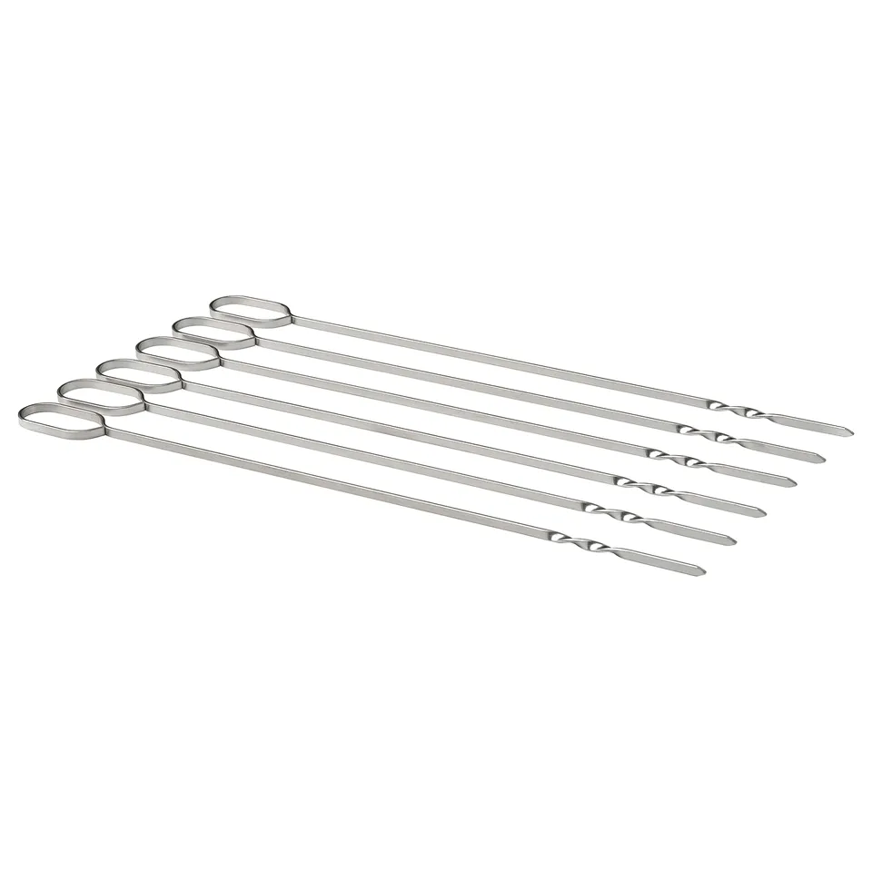 Six stainless steel bbq skewers with flat design and loop handles, arranged neatly in a row.