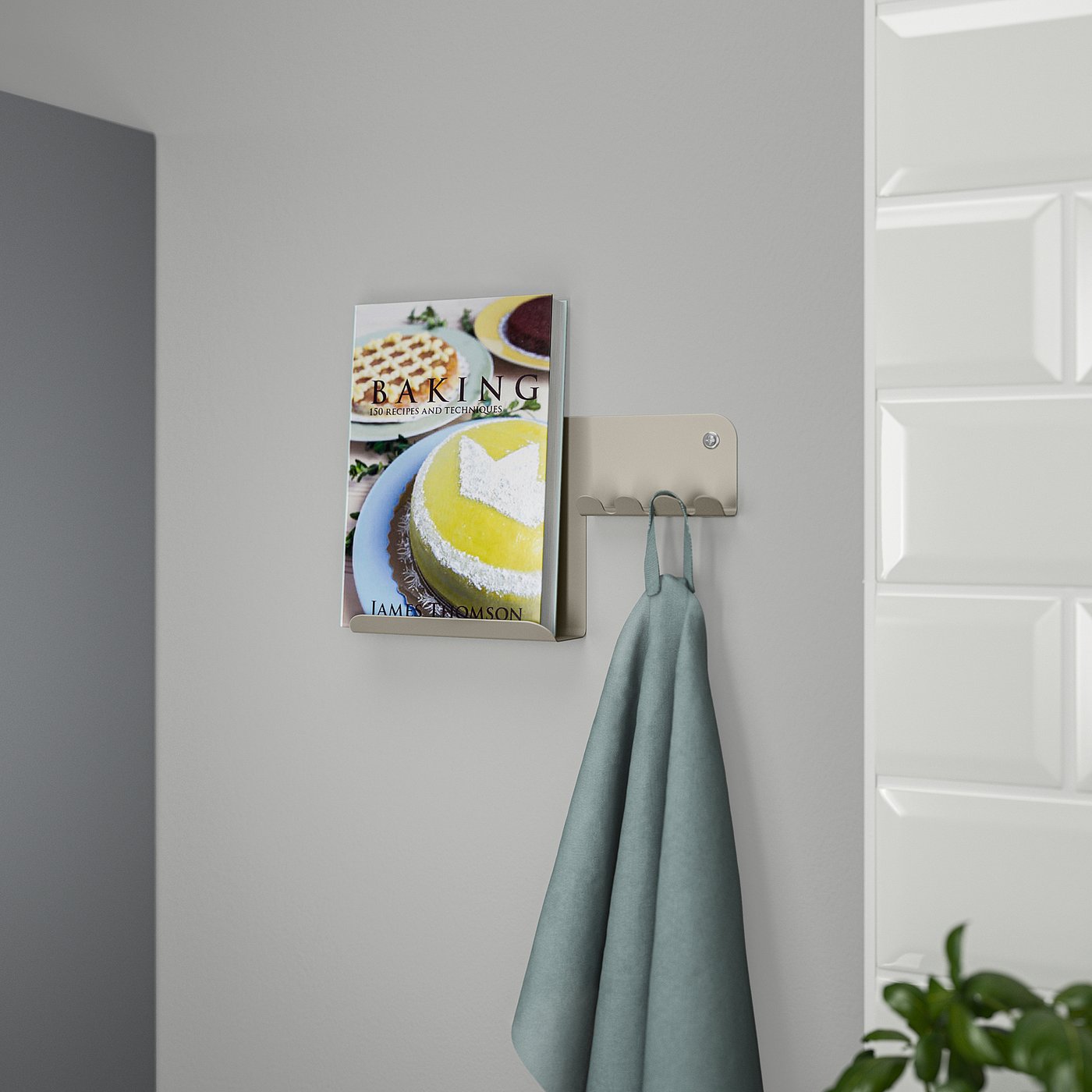 Wall-mounted organiser holds book and cloth; keeps items accessible.