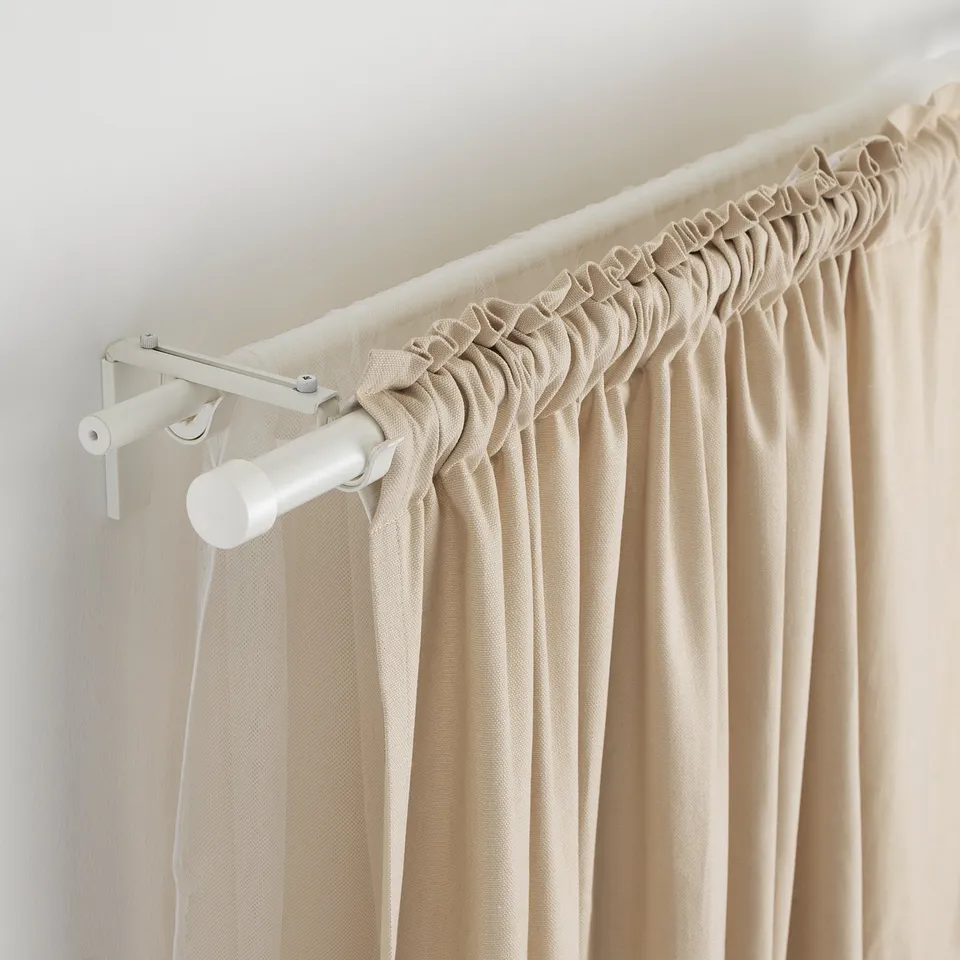 White adjustable curtain rod, 210 cm, beige curtains, wall brackets.