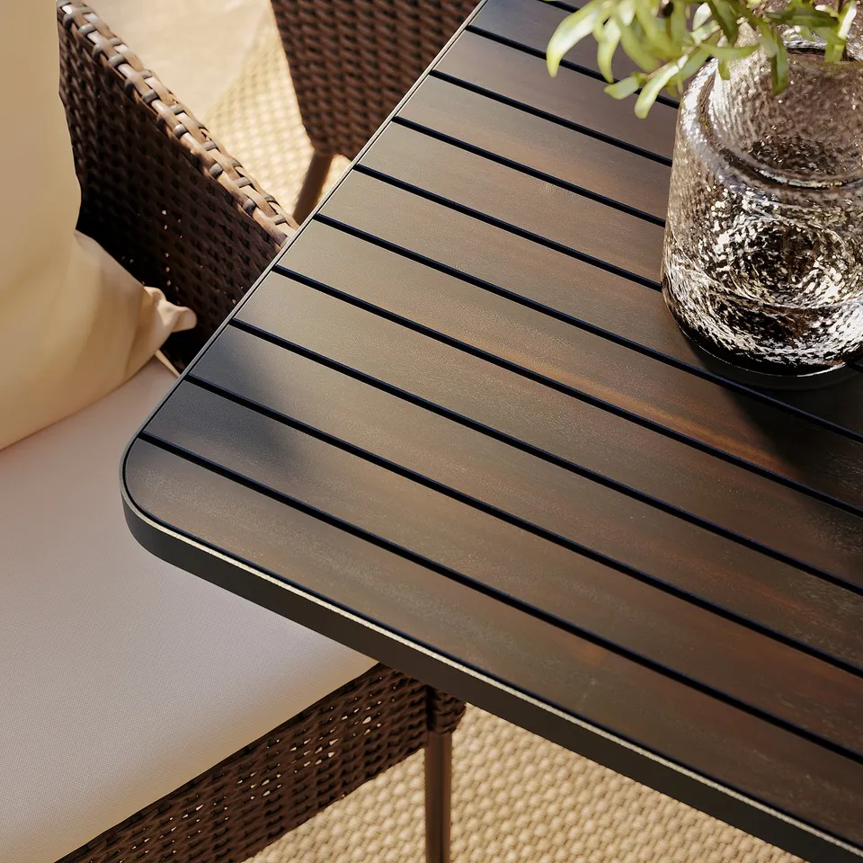Modern outdoor dining set with sleek, brown metal table and woven chairs, showcasing high-quality, weather-resistant materials.