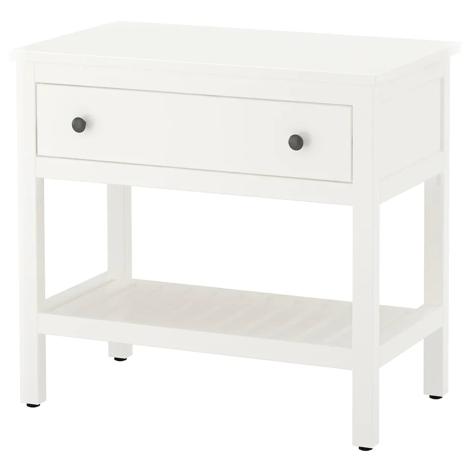 A white HEMNES bedside table with a single drawer and an open shelf. It a smooth, crafted design for a scandinavian look.