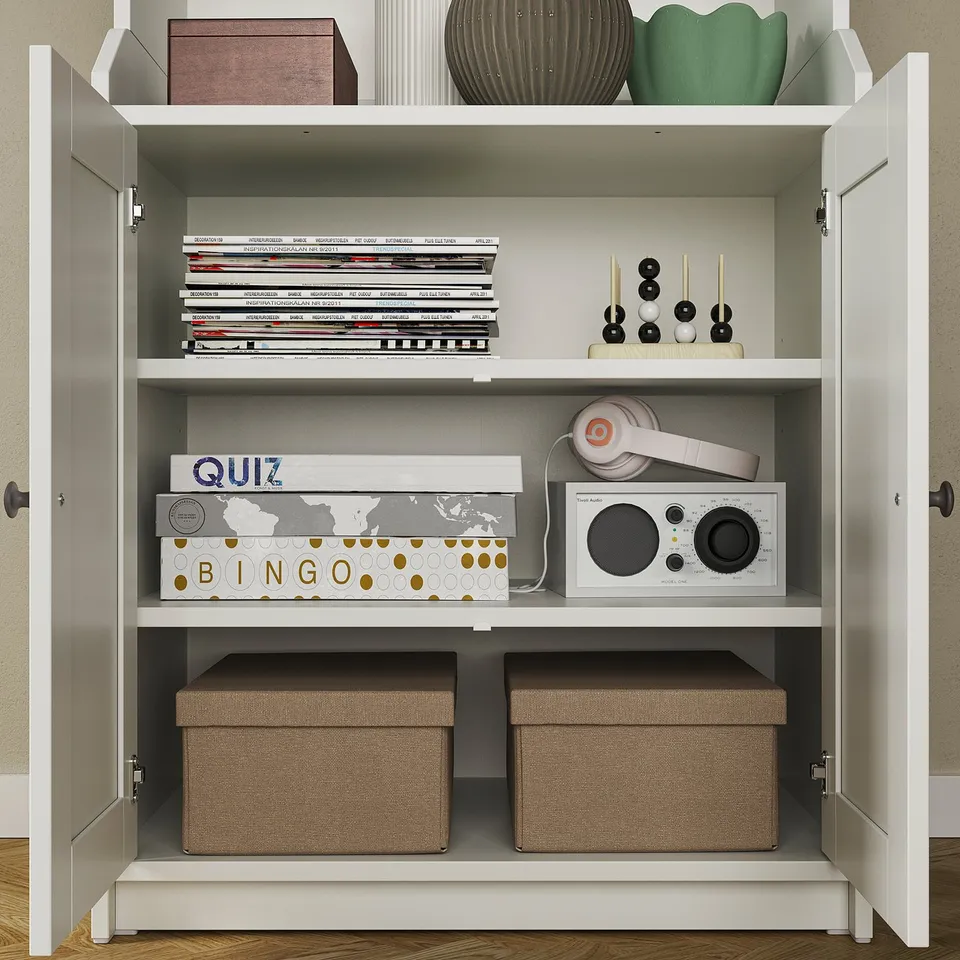 Shelf with open and closed storage, headphones, radio, board games.