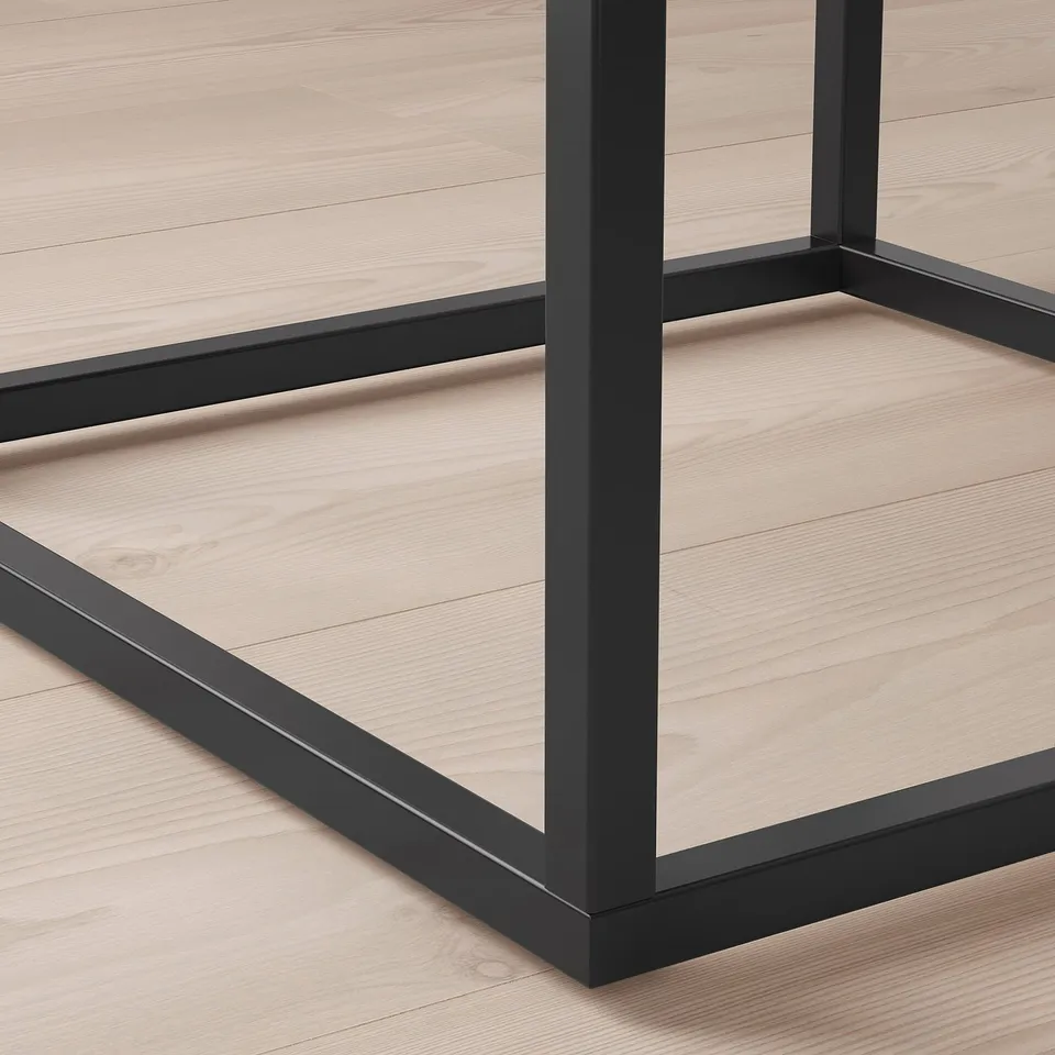 Modern, minimalist bedside table with smooth edges. Crafted from fibreboard and steel, showcasing quality construction.
