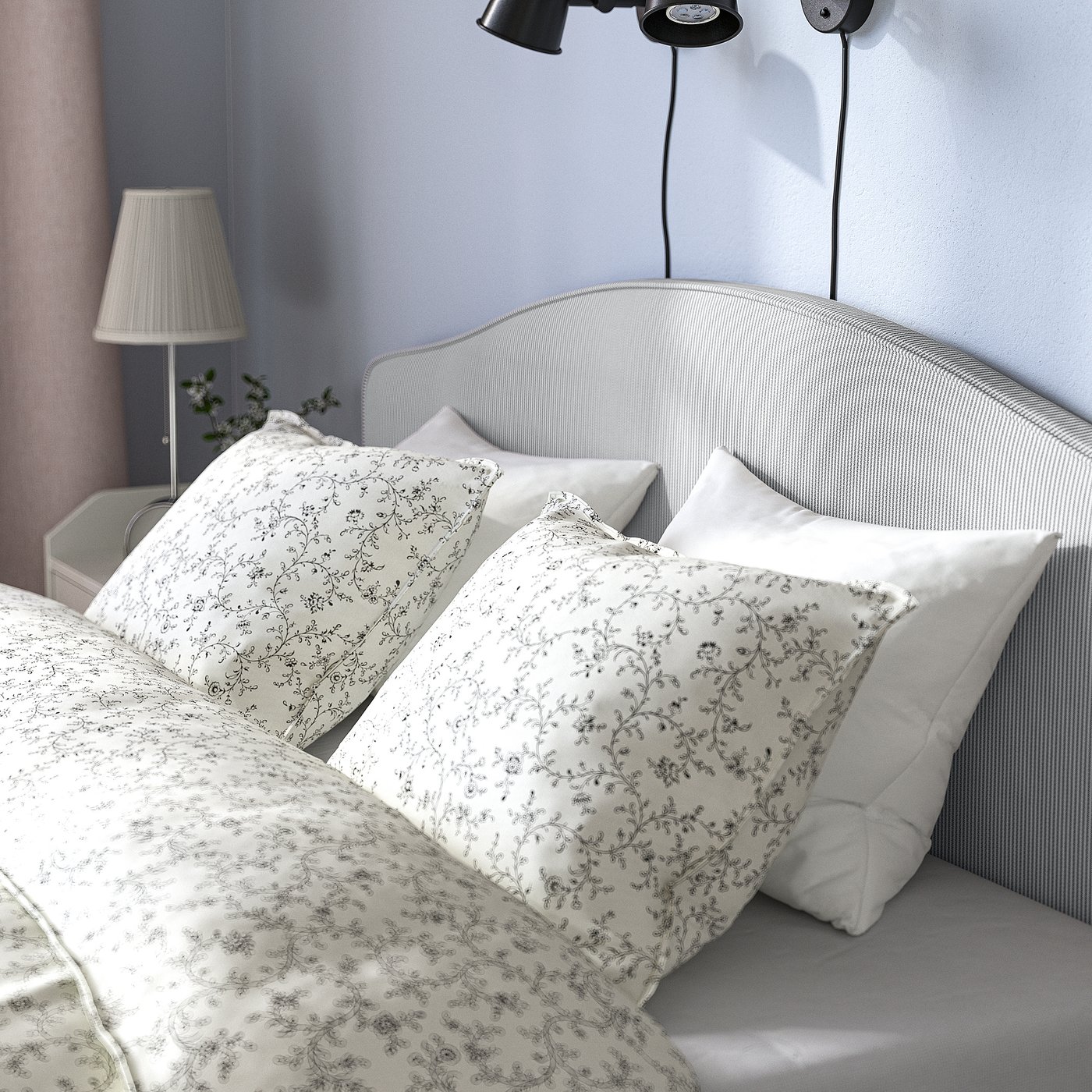 Cosy bed with padded headboard, removable washable cover, and side lamp.
