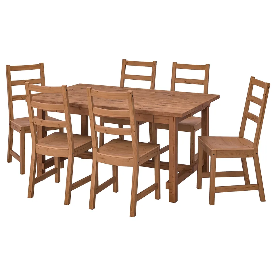 Wooden dining set with six chairs and a rectangular table. Simple, sturdy design in light brown.