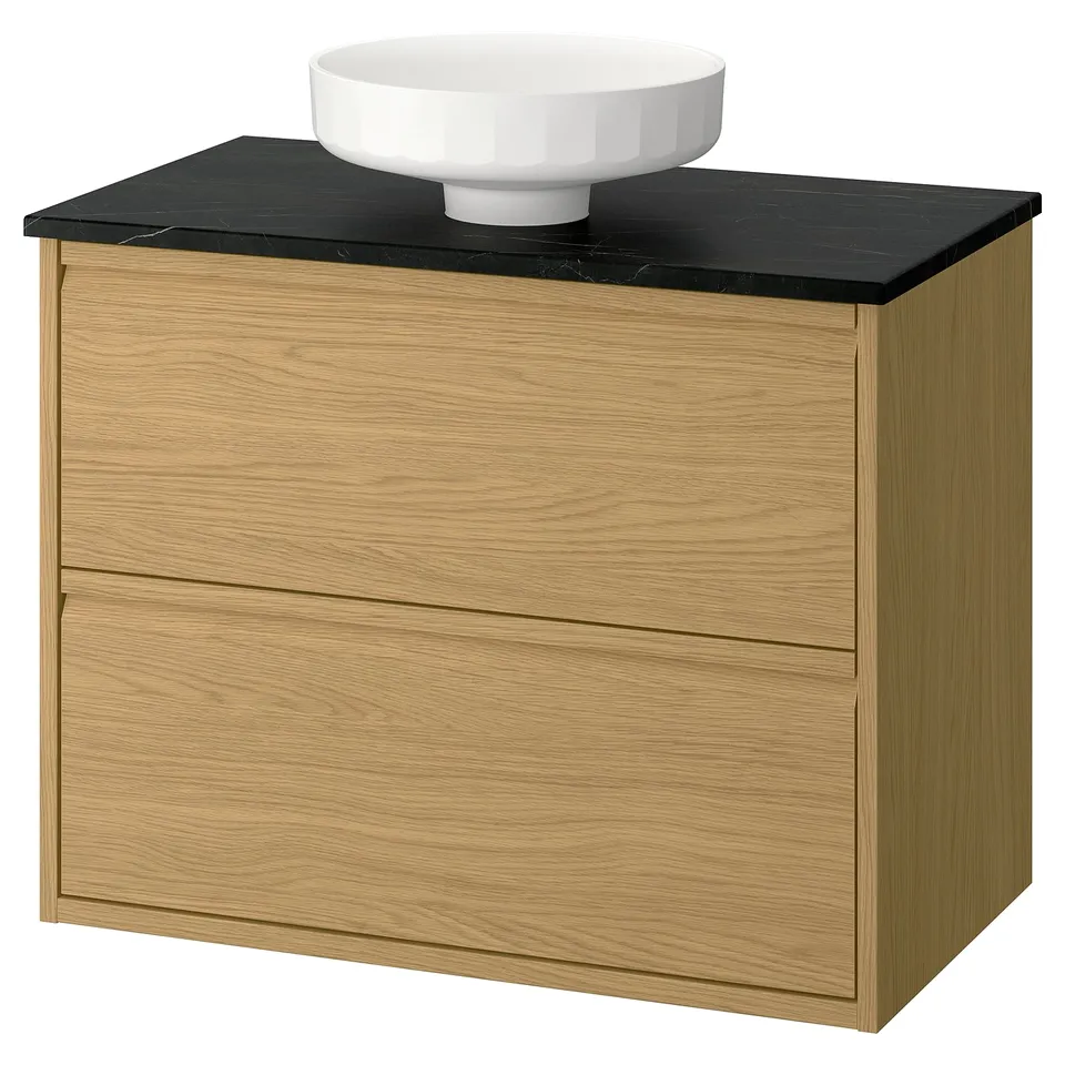 Öak-effekt bathroom unit: light wood, dark counter, round basin, modern design.