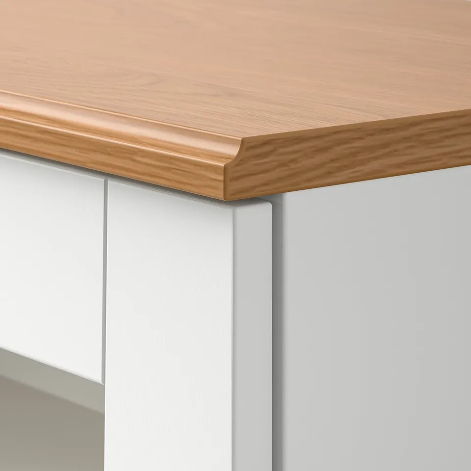 SKRUVBY wooden countertop with light grey cabinet detail. Fine grain texture and sleek design.