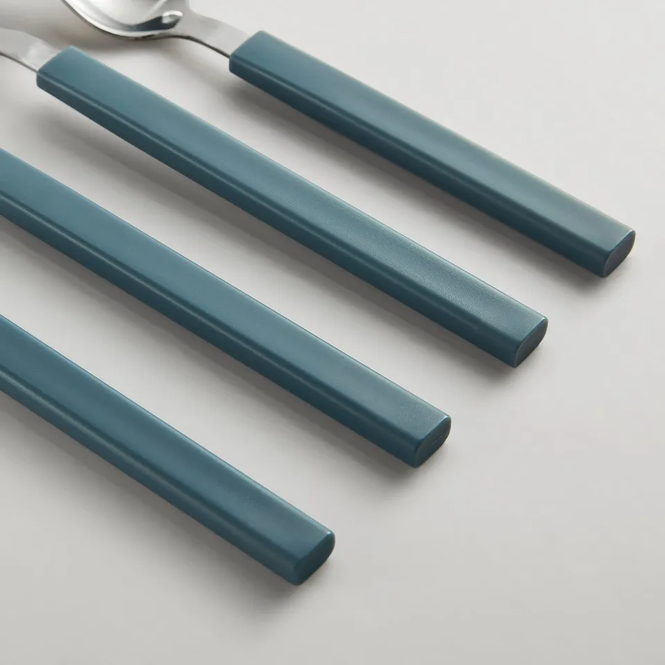 Modern cutlery set: fork, knife, spoons with blue handles, stainless-steel blades.
