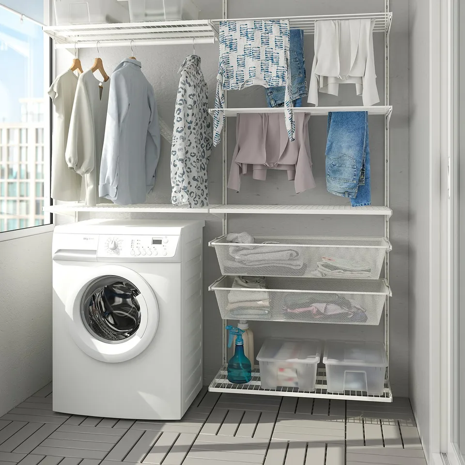 BOAXEL wall storage in laundry with drying rack and washing machine.