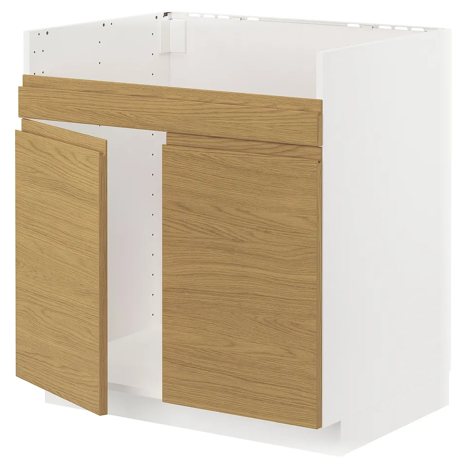 A white and wood METOD kitchen cabinet with a modern design and integrated handles.