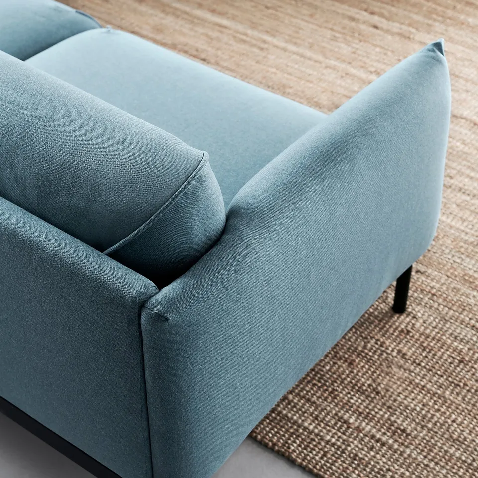 ÄPPLARYD teal sofa, soft fabric, square shape, and slim black legs.