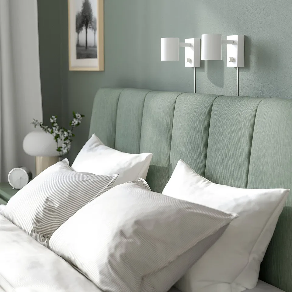 Modern bed with adjustable sides, soft headboard, and under-bed storage.