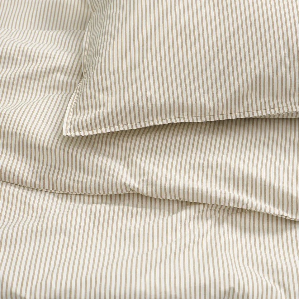 Striped cotton bedding, neatly folded.