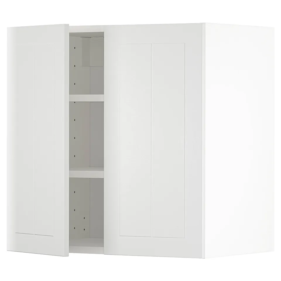 A white METOD kitchen cabinet with adjustable shelves and snap-on hinges.