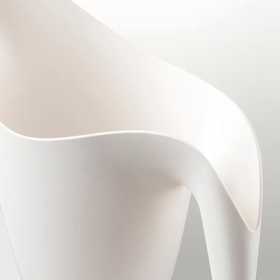 Sleek, modern white watering can, elegantly curved, with a smooth finish.