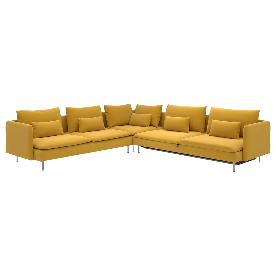 Bright yellow l-shaped sofa bed with metal legs, deep cushions, and multiple pillows, offering comfort and versatility.