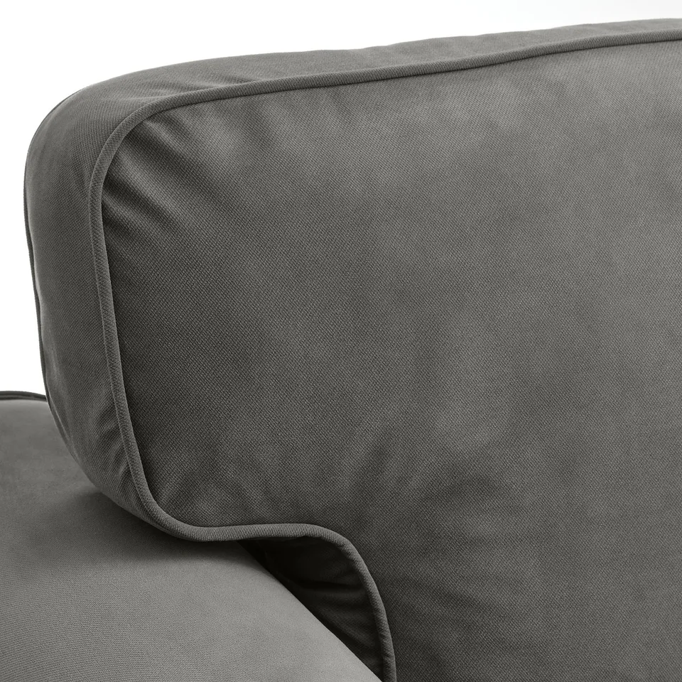 Comfortable, high-quality grey sofa bed armrest. Soft, textured fabric with neat stitching for durability.