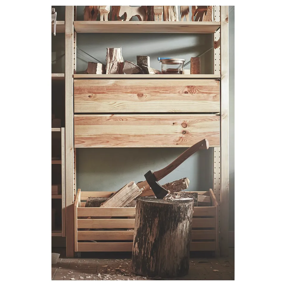 Wooden storage shelves with drawers, axe, and chopped wood. Rustic design, natural pine colour.