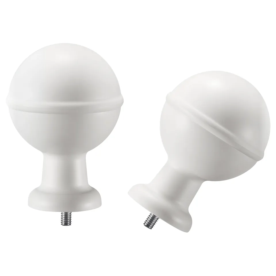 Two white spherical curtain rod finials with screws, one upright, one angled.