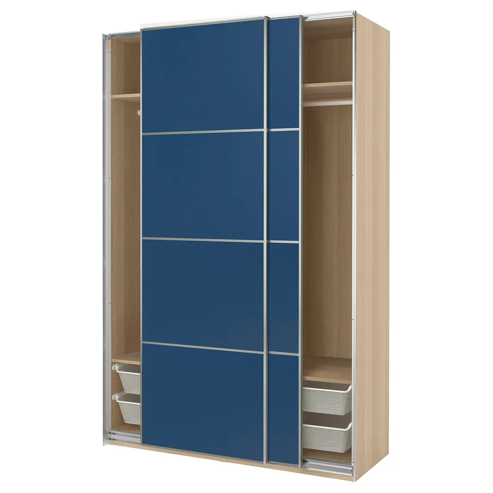 A light wooden IKEA PAX wardrobe with blue sliding doors and metal mesh baskets.