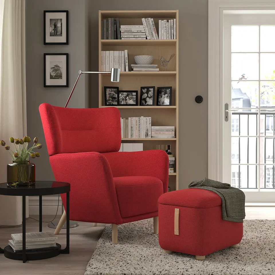 Modern living room with red OSKARSHAMN chair, footstool & side table.