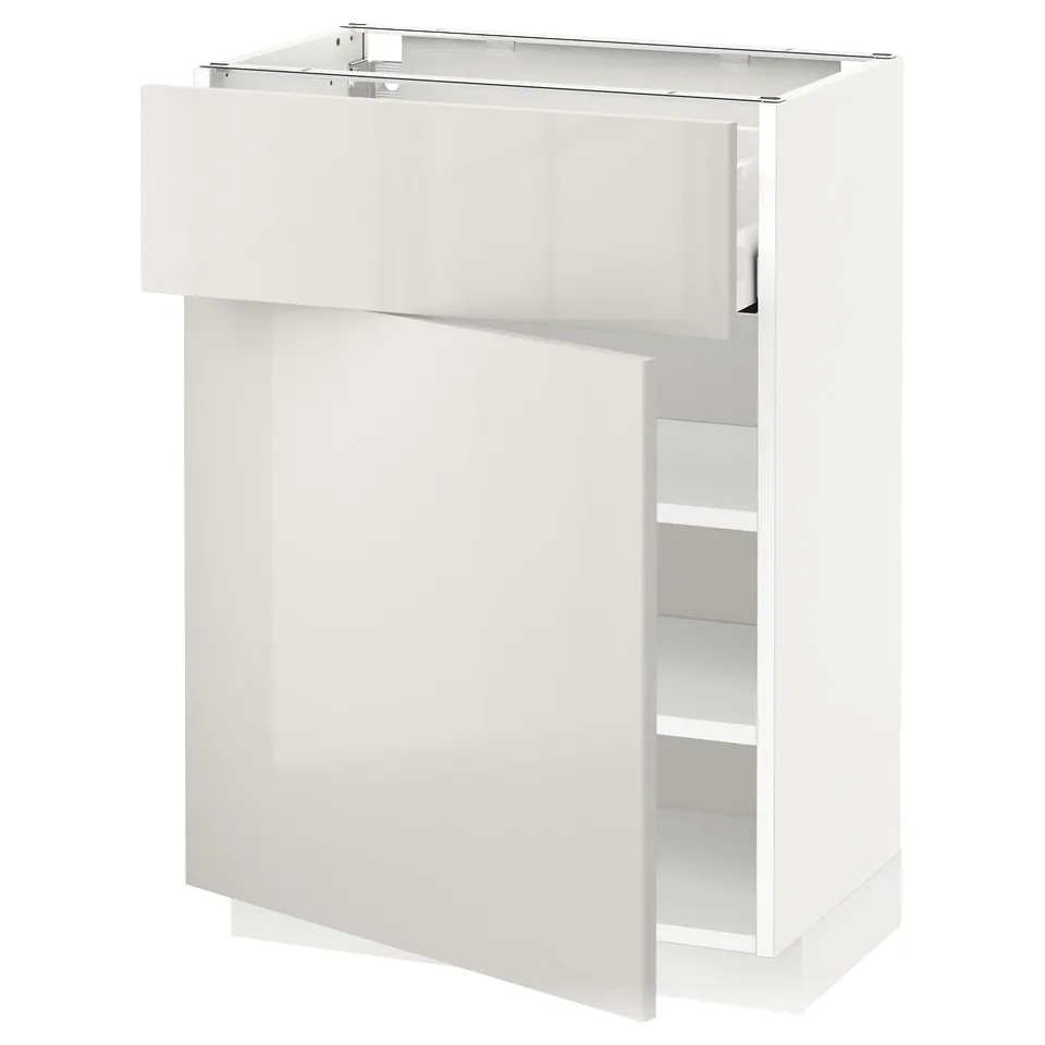A white METOD kitchen cabinet, sleek and modern with a glossy finish and adjustable shelves.
