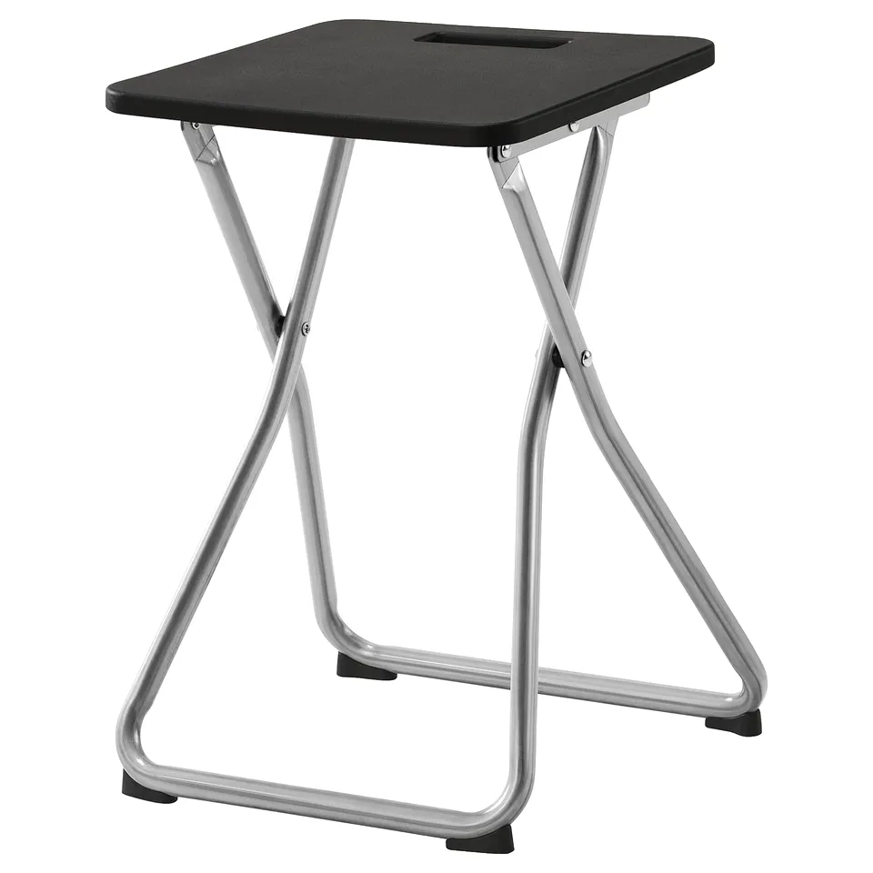 A GUNDE black foldable stool with a metal frame. It has a square seat and is designed for easy storage.