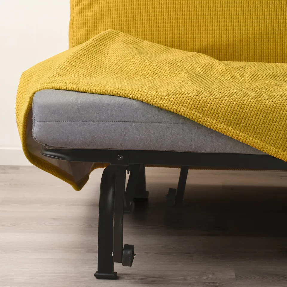 Yellow sofa with grey mattress, on black legs.