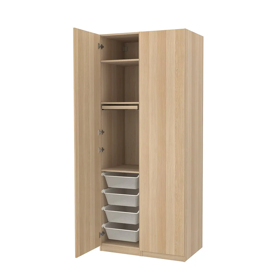 Beige PAX wardrobe, wooden, compact design. Has drawers, mesh baskets, hanging space.