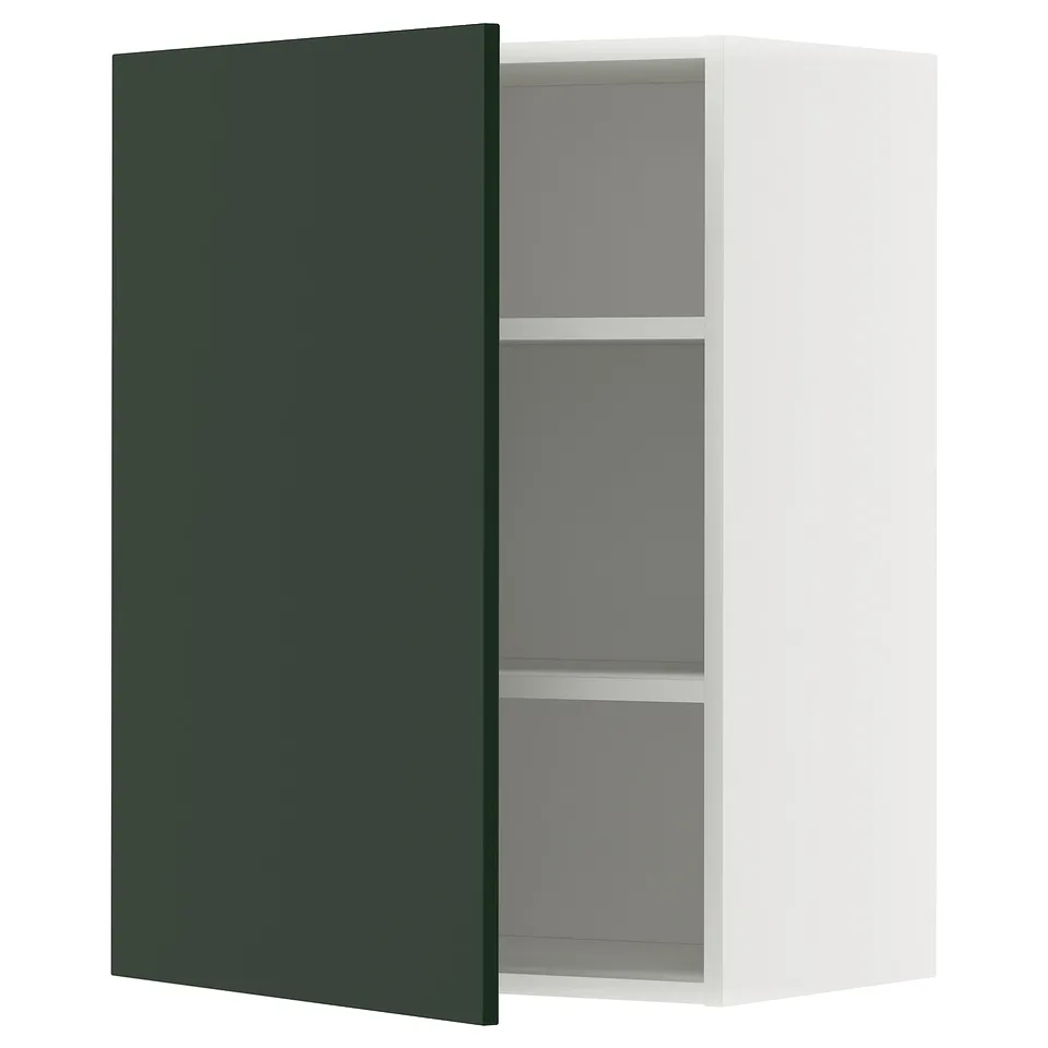 A white wall cabinet with a green door slightly open, revealing adjustable grey shelves inside. Part of METOD kitchen system.