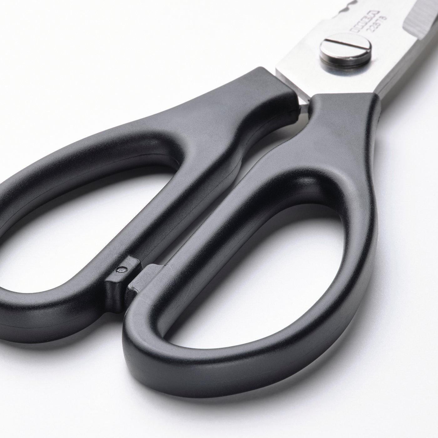 Closed black kitchen scissors with stainless steel blades and comfortable handles. Designed for both right and left-handed users.