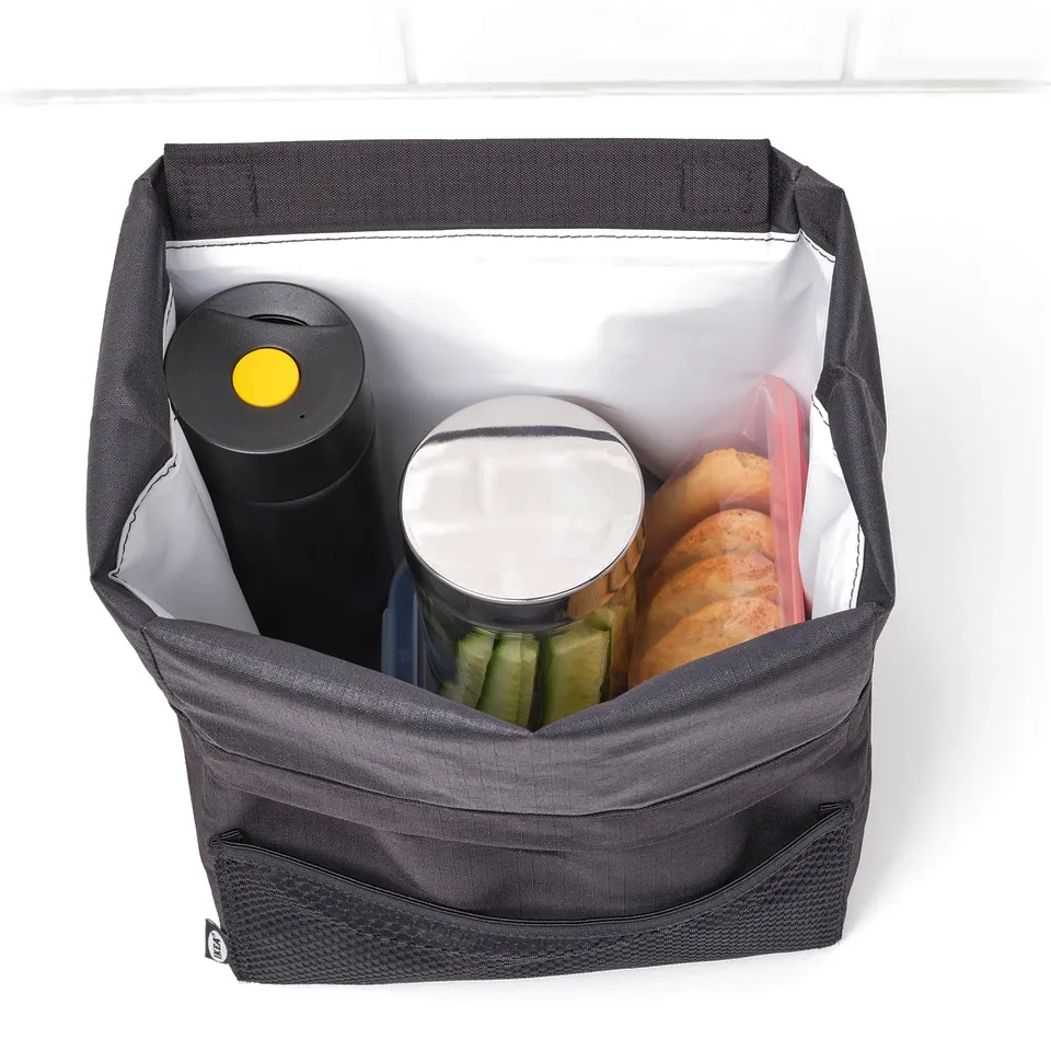Insulated mug in bag with bread, jar, and bottle. Lid opens one-handed for easy access.