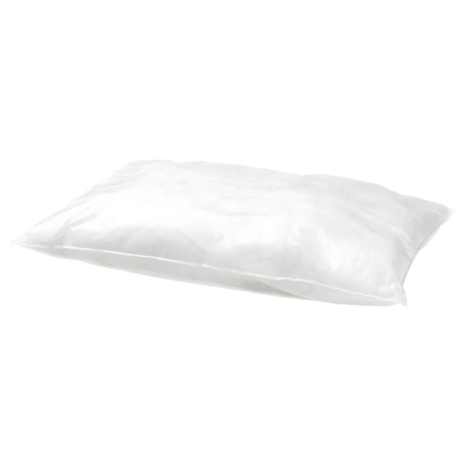 White SKÖLDBLAD pillow. Rectangular shape, smooth fabric, soft design.