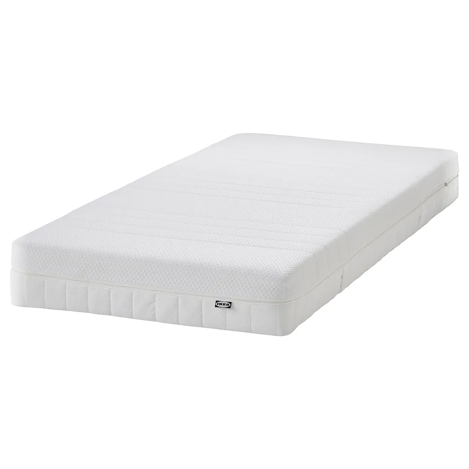 IKEA HEMNES white foam mattress, rectangular, simple design, smooth texture.