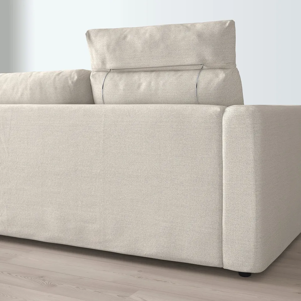 Beige sofa with detachable headrest, displaying comfort and customizable design.