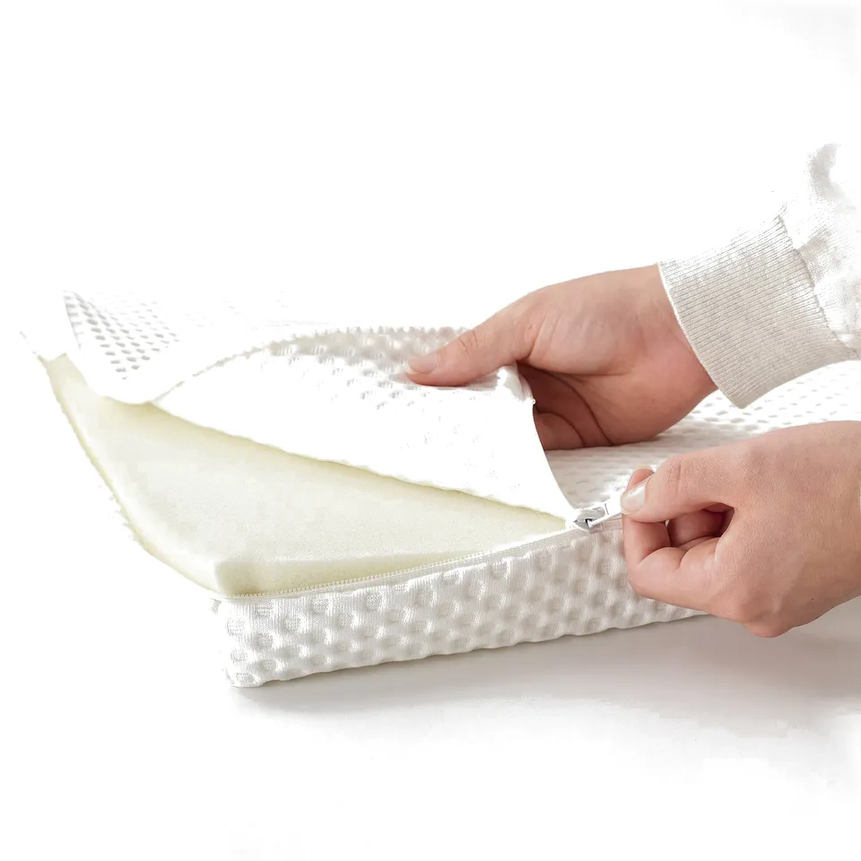 Person zipping mattress cover, showing easy removal for washing.