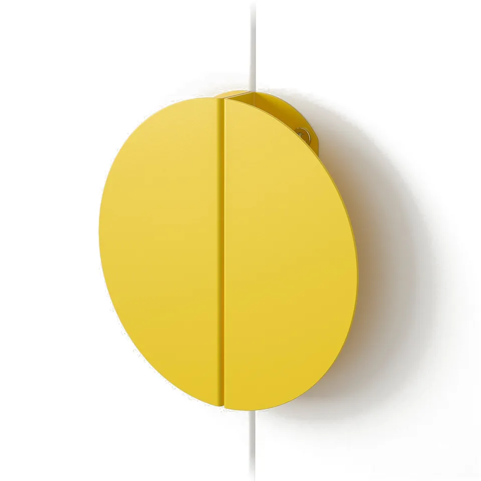 Bright yellow circular handle on white wall; smooth, modern design.