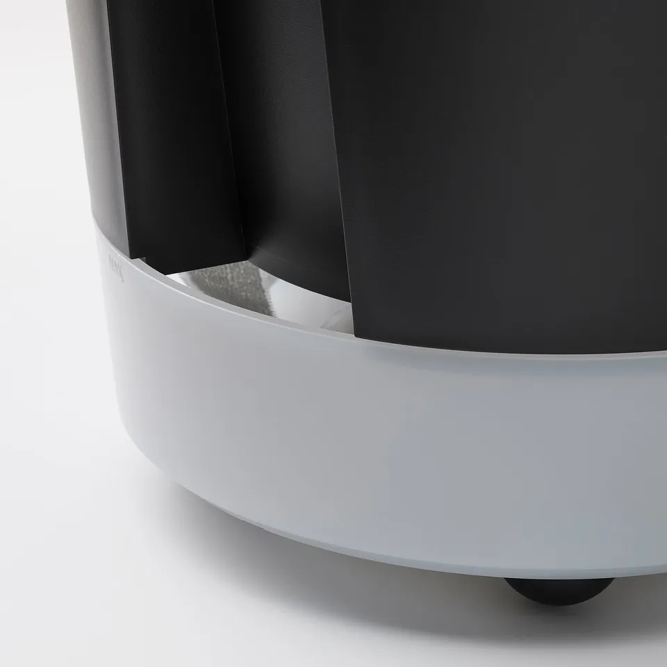 Modern self-watering planter with frosted base, sleek design, and smooth surfaces.