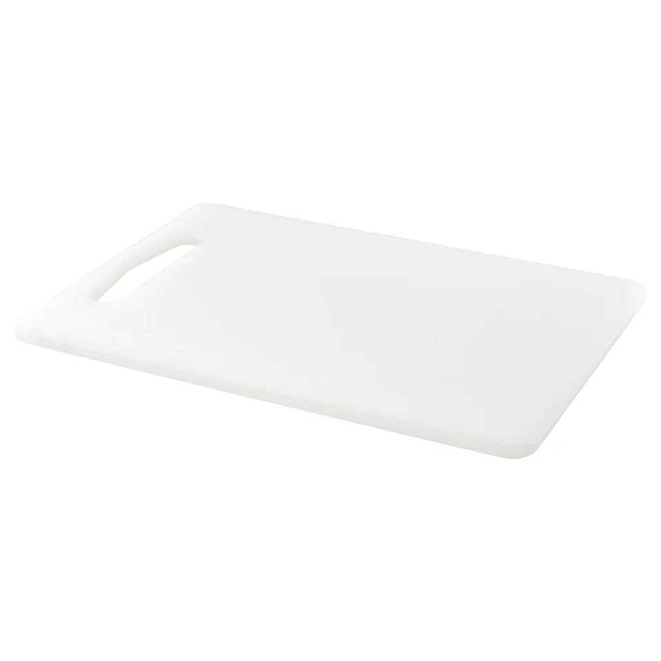 A single white chopping board made of polyethylene plastic with smooth surface and handy handle.