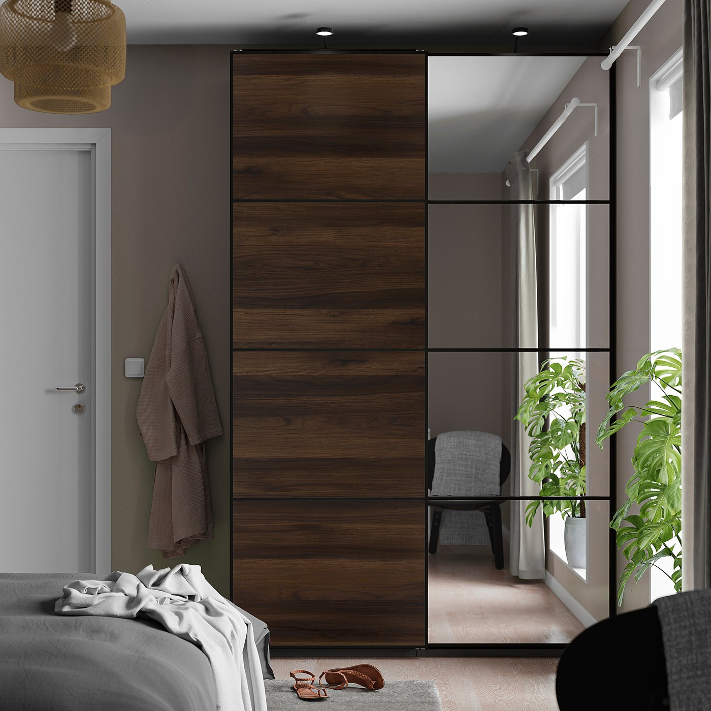 Bedroom with large PAX wardrobe featuring sliding mirrored doors, a robe hanging on the left, and a plant beside it.