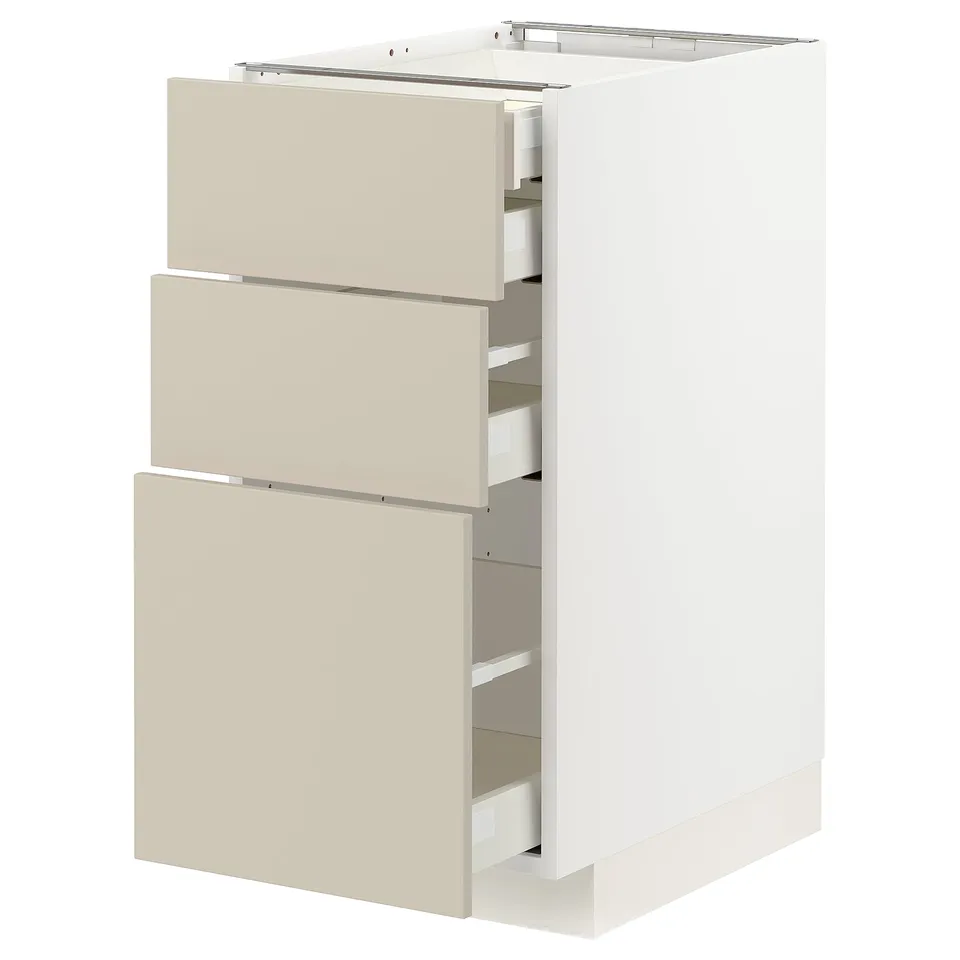 White METOD kitchen cabinet, beige drawers, three smooth, handle-less drawers, rectangular, modern.
