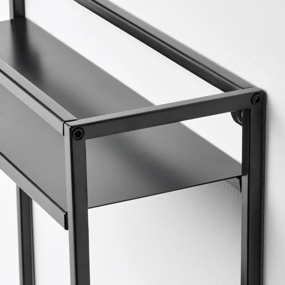 Metal shelving unit, three tiers, modern design. Solid construction, clean lines. Perfect for displaying items.
