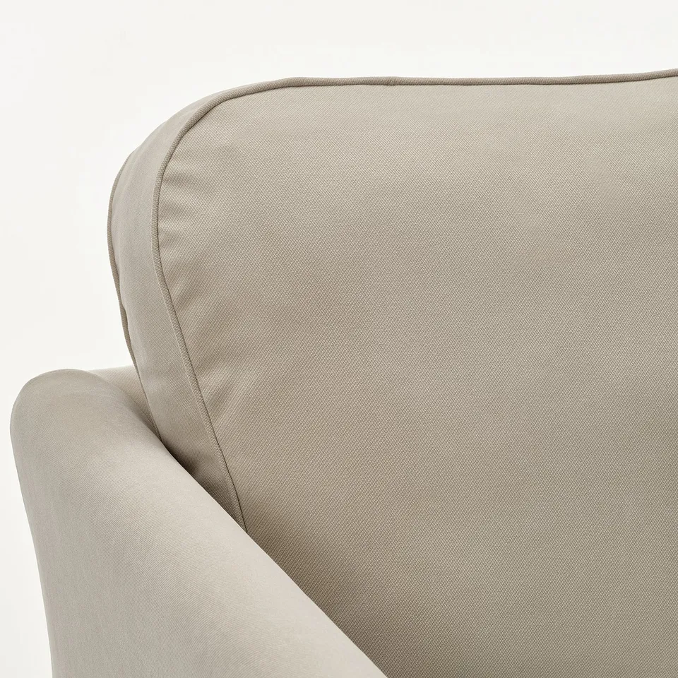 Close-up of a modern, comfortable sofa with smooth fabric and supportive cushions.