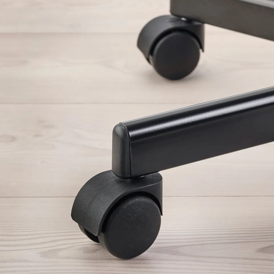 Close-up of sturdy office chair casters, highlighting robust design and smooth-rolling wheels.