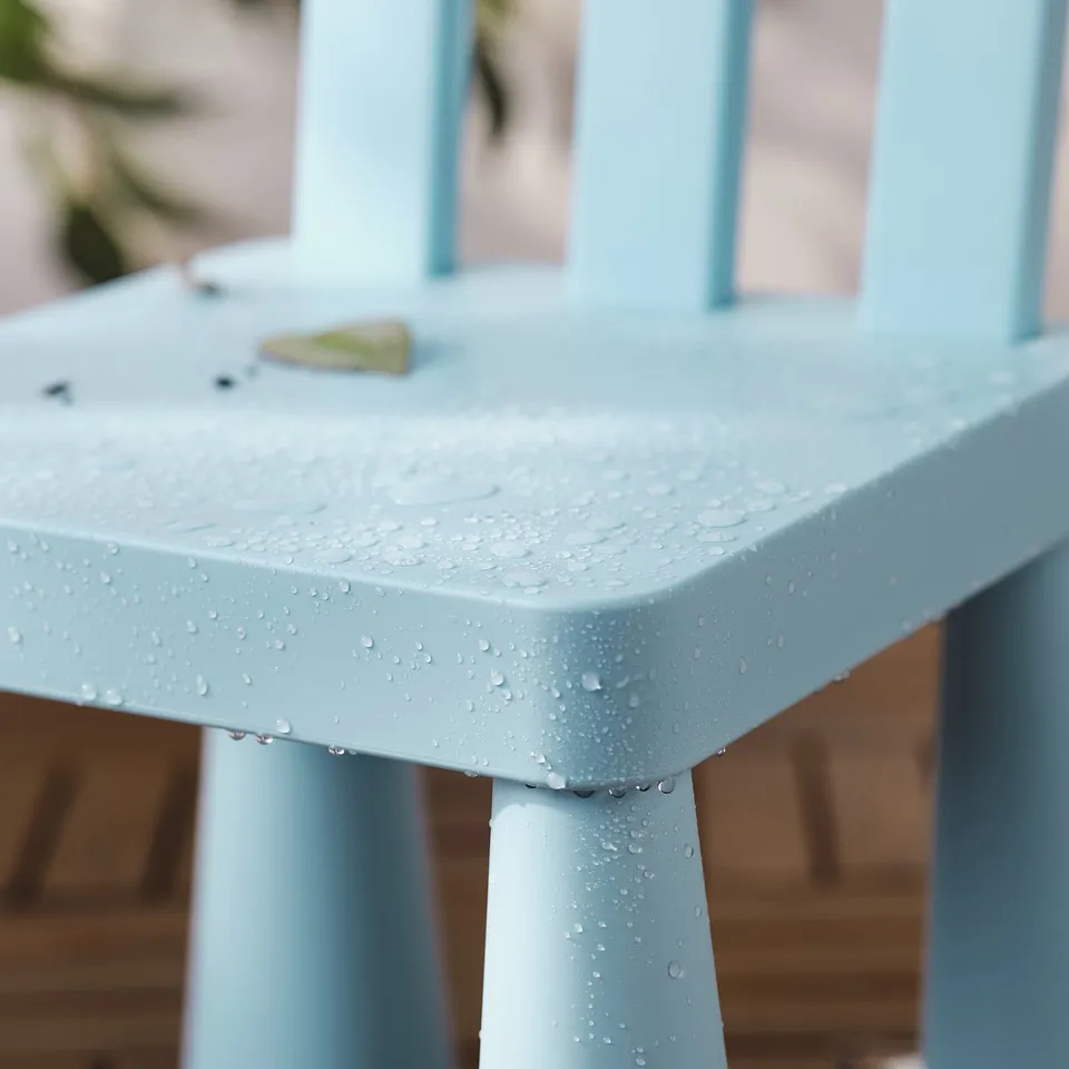 Light blue kids table with water droplets, perfect for outdoor use and easy cleaning.
